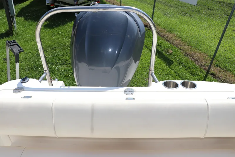 Slide: The Image of 2008 Robalo R227 Dual Console boat with outboard motor and cup holders. - 11