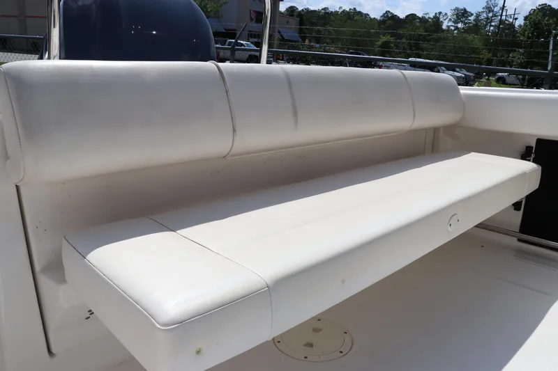 Slide: The Image of 2008 Robalo R227 Dual Console boat with white cushioned seating. - 14