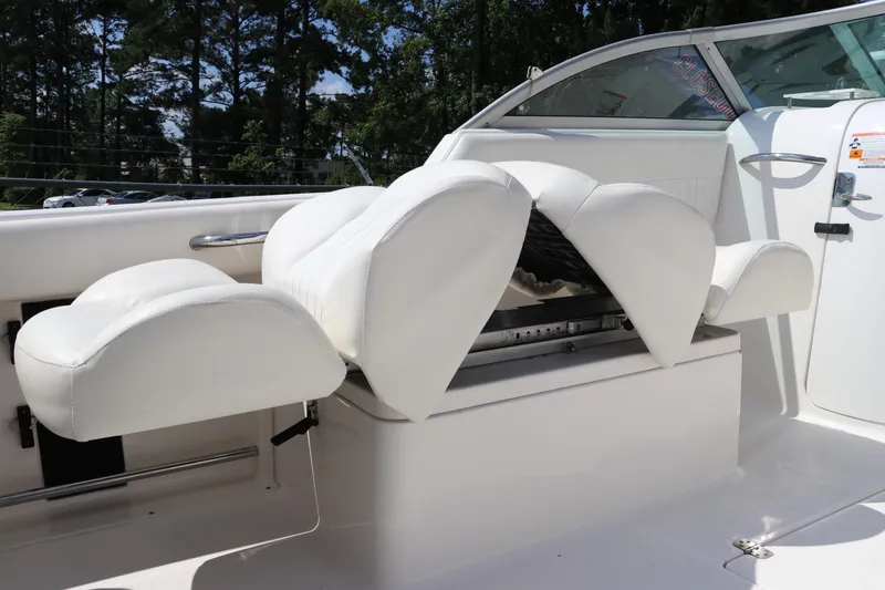 Slide: The Image of 2008 Robalo R227 Dual Console boat with white cushioned seating. - 17