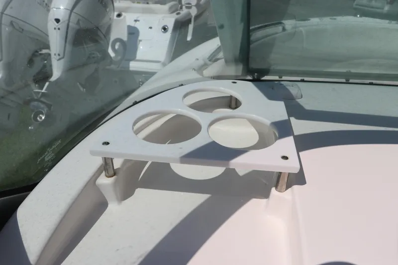 Slide: The Image of 2008 Robalo R227 Dual Console boat cup holder on deck. - 21