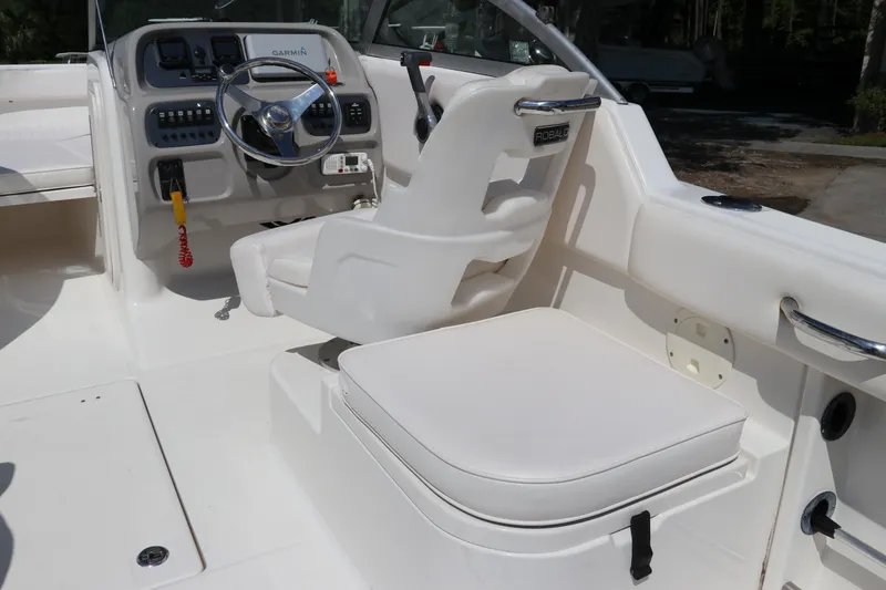 Slide: The Image of 2008 Robalo R227 Dual Console boat interior with steering wheel and seating. - 26