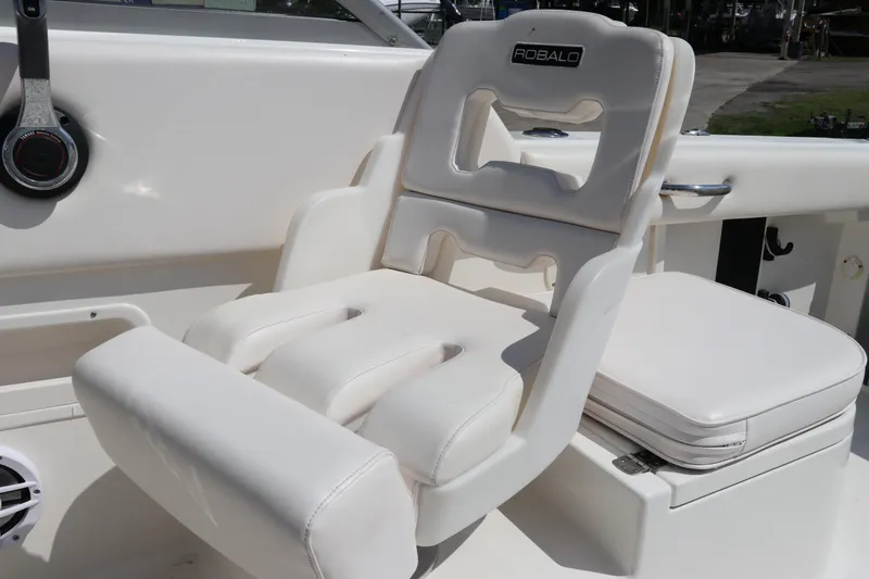 Slide: The Image of 2008 Robalo R227 Dual Console boat seat, white upholstery, modern design. - 28