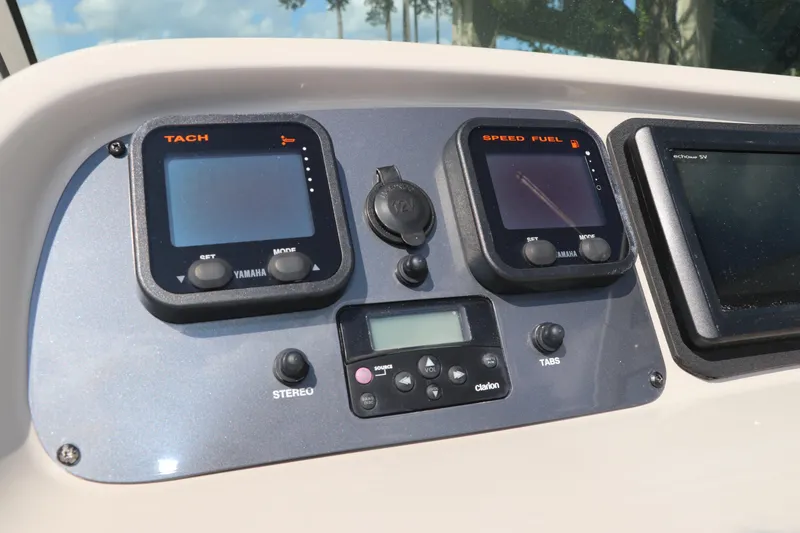 Slide: The Image of Dashboard of 2008 Robalo R227 Dual Console boat with Yamaha gauges and Clarion stereo. - 31