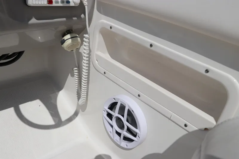 Slide: The Image of 2008 Robalo R227 Dual Console boat interior with speaker and control panel. - 36