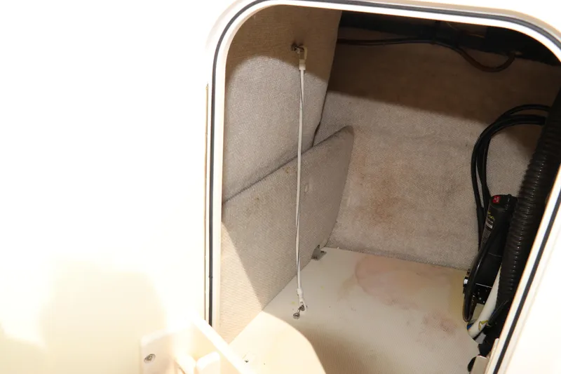 Slide: The Image of 2008 Robalo R227 Dual Console storage compartment interior view. - 40