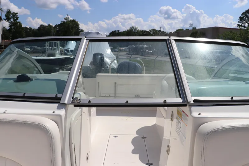 Slide: The Image of 2008 Robalo R227 Dual Console boat interior with windshield and seating. - 41