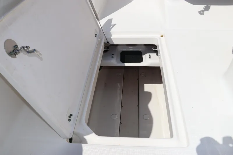 Slide: The Image of Open storage compartment on 2008 Robalo R227 Dual Console boat. - 45