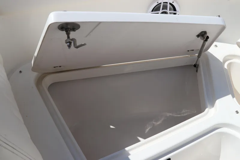 Slide: The Image of Open storage compartment on a 2008 Robalo R227 Dual Console boat. - 46
