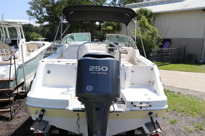 Slide: The Image of 2008 Robalo R227 Dual Console boat with 250 horsepower engine, parked outdoors. - 7