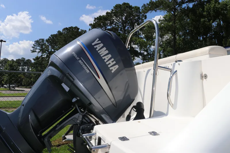 Slide: The Image of 2008 Robalo R227 Dual Console with Yamaha four-stroke engine, parked outdoors. - 9