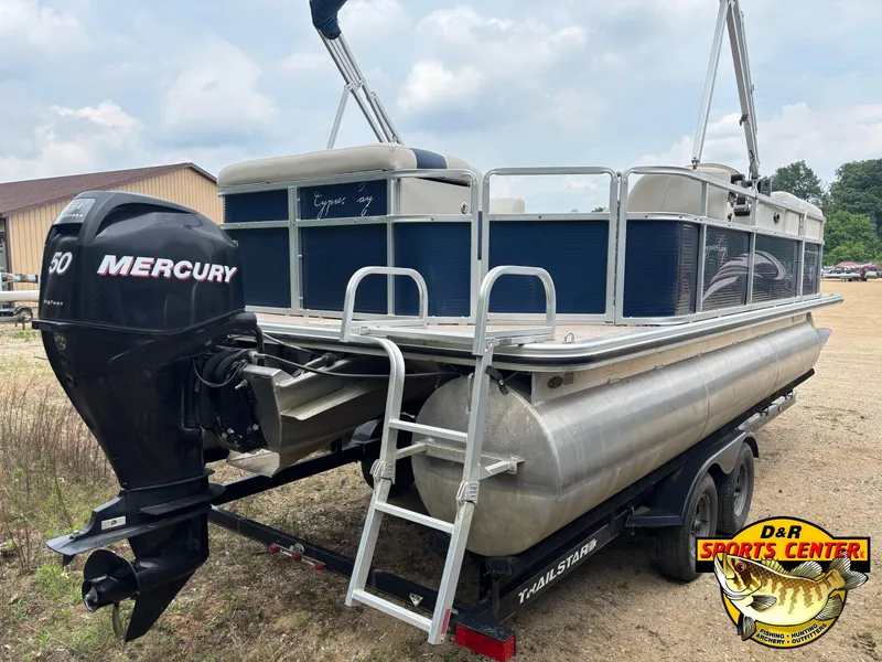 Slide: The Image of 2010 Cypress Cay 210 Seabreeze pontoon boat with Mercury 50 outboard motor on trailer. - 2