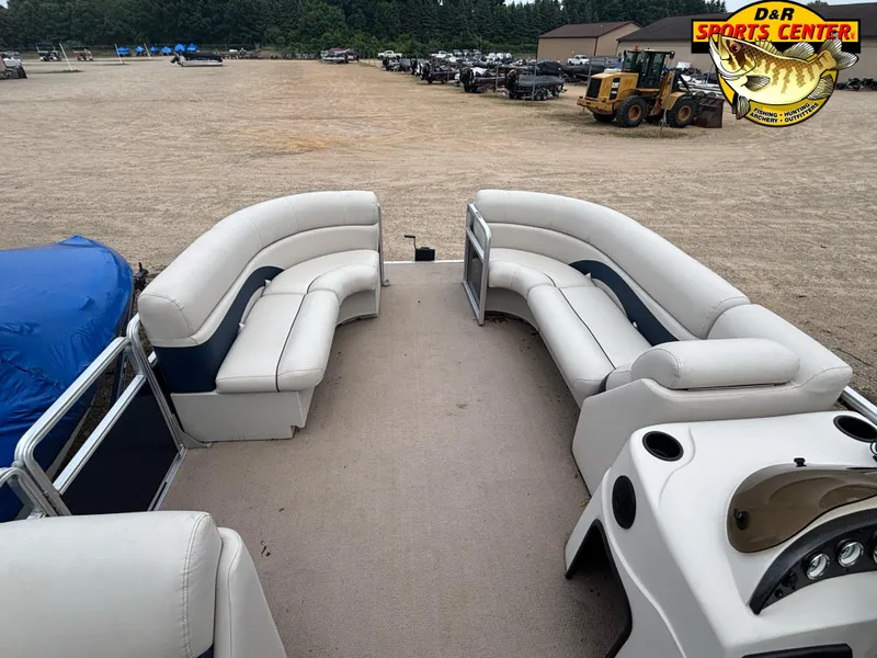 Slide: The Image of 2010 Cypress Cay 210 Seabreeze pontoon boat with spacious seating and outdoor setting. - 4