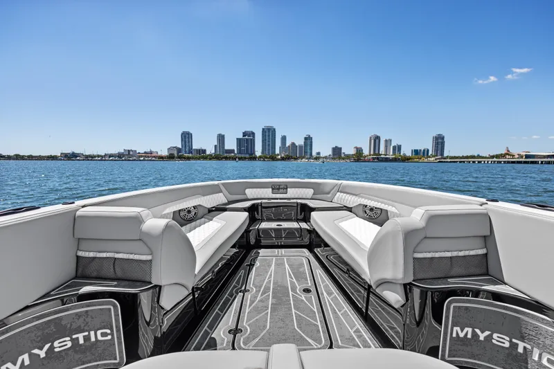 Slide: The Image of 2026 Mystic Powerboats M4200 interior with city skyline and water view. - 15