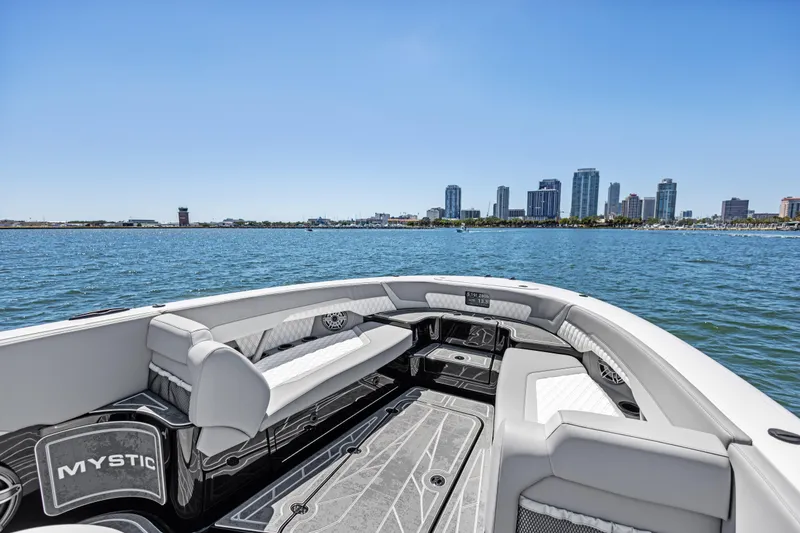 Slide: The Image of 2026 Mystic Powerboats M4200 on water with city skyline in background. - 16