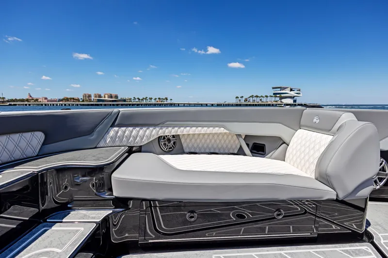 Slide: The Image of Luxurious seating on 2026 Mystic Powerboats M4200, with ocean view and clear blue sky. - 18
