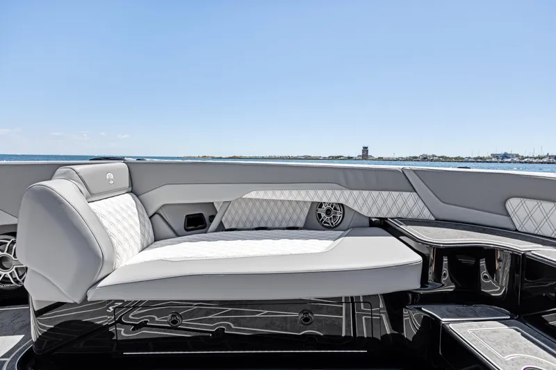Slide: The Image of Luxurious seating on 2026 Mystic Powerboats M4200, featuring elegant design and ocean backdrop. - 19