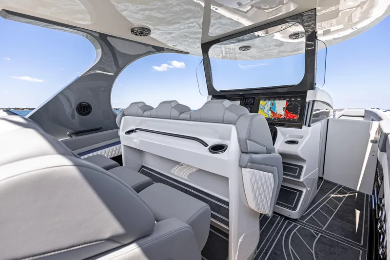 Slide: The Image of Luxurious interior of 2026 Mystic Powerboats M4200 with modern seating and navigation system. - 36