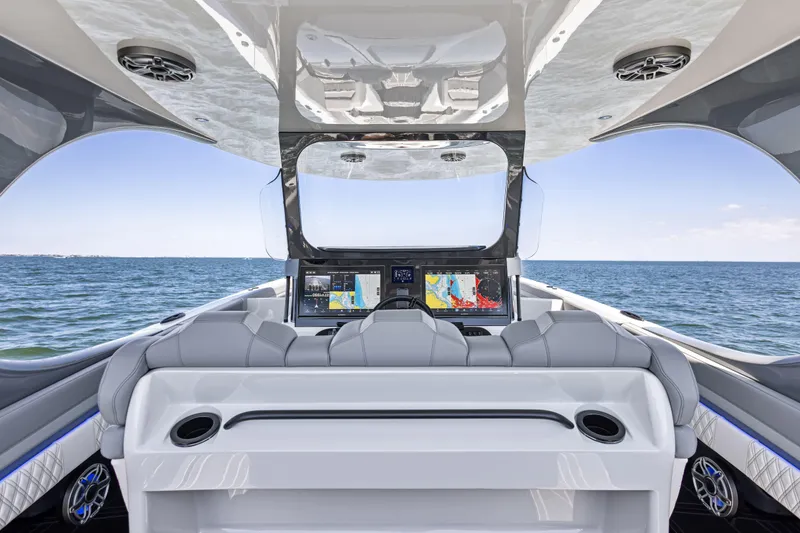 Slide: The Image of Interior view of 2026 Mystic Powerboats M4200, featuring advanced navigation screens and luxurious seating. - 37