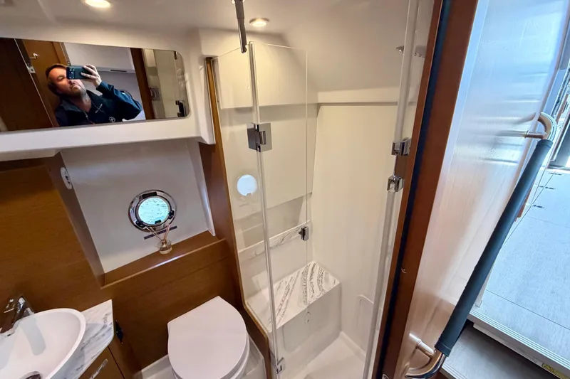 Slide: The Image of Bathroom interior of 2026 Beneteau Swift Trawler 37 Fly with modern fixtures. - 19