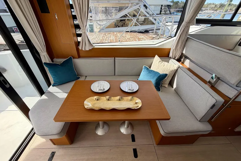 Slide: The Image of Interior of 2026 Beneteau Swift Trawler 37 Fly with cozy seating and dining area. - 20