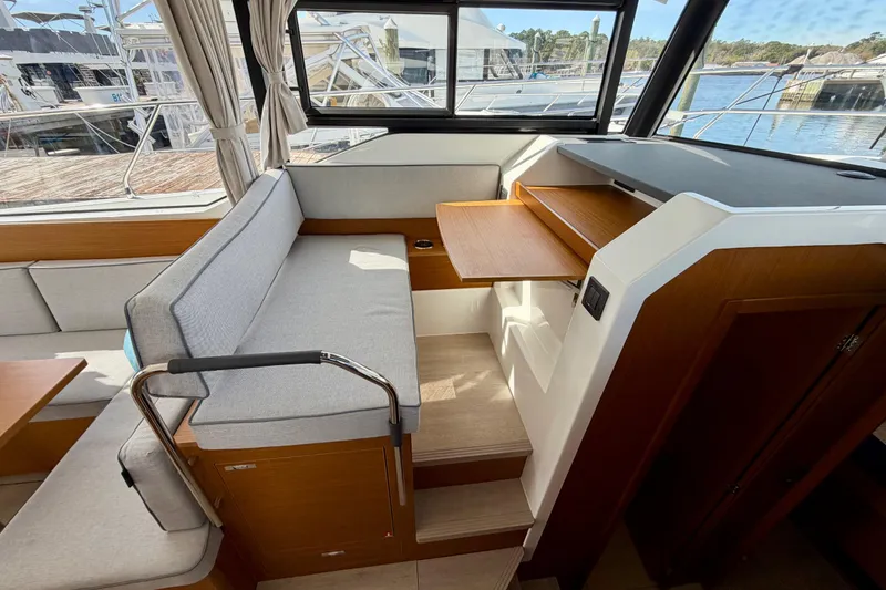 Slide: The Image of Interior of 2026 Beneteau Swift Trawler 37 Fly with seating and wooden accents. - 23
