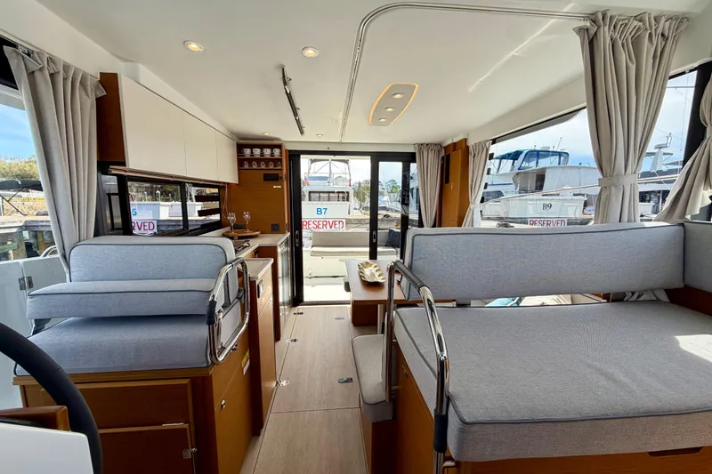 Slide: The Image of Interior of 2026 Beneteau Swift Trawler 37 Fly, featuring modern seating and elegant design. - 25