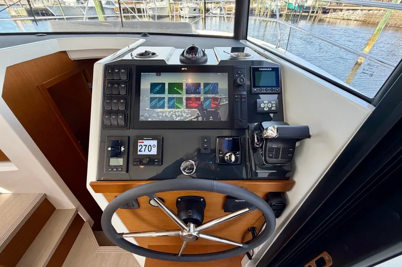 Slide: The Image of Helm station of 2026 Beneteau Swift Trawler 37 Fly with advanced navigation controls. - 26