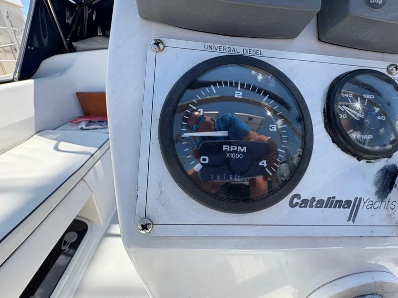 Slide: The Image of Close-up of a 2006 Catalina 350 yacht's RPM gauge and dashboard. - 11