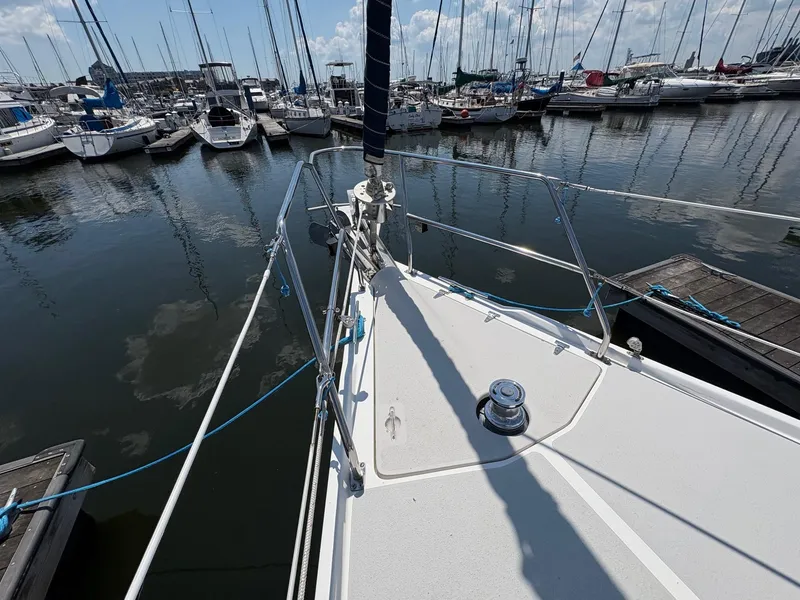 Slide: The Image of Bow of a 2006 Catalina 350 sailboat docked in a marina. - 14