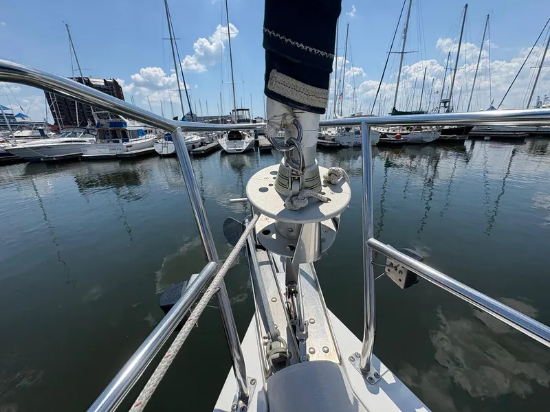 Slide: The Image of Bow view of a 2006 Catalina 350 sailboat docked in a marina. - 16