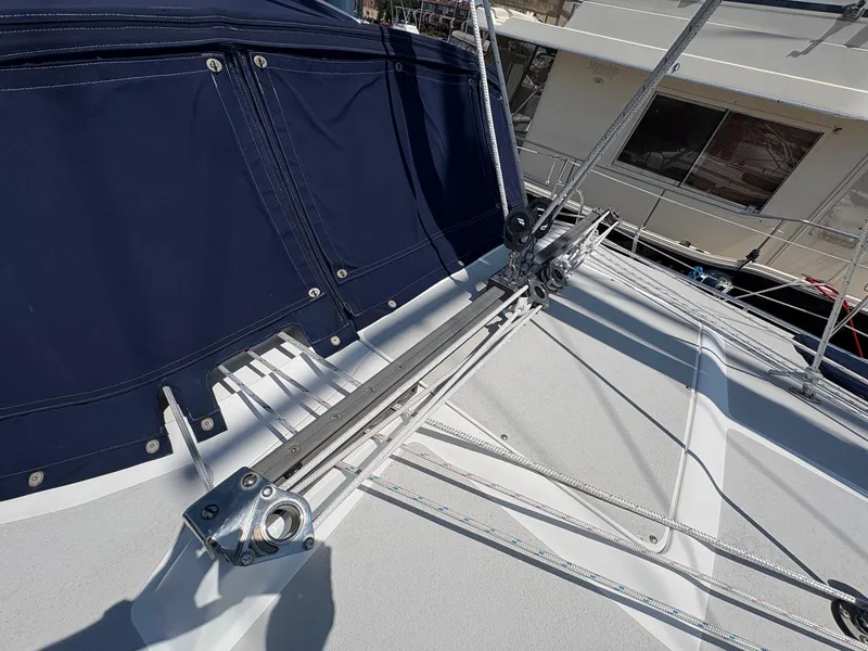 Slide: The Image of Sailboat deck of 2006 Catalina 350 with rigging and blue canvas cover. - 19