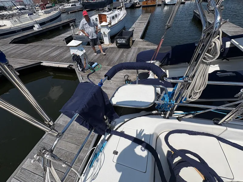 Slide: The Image of Catalina 350 sailboat docked at marina, 2006 model, with nautical equipment visible. - 6