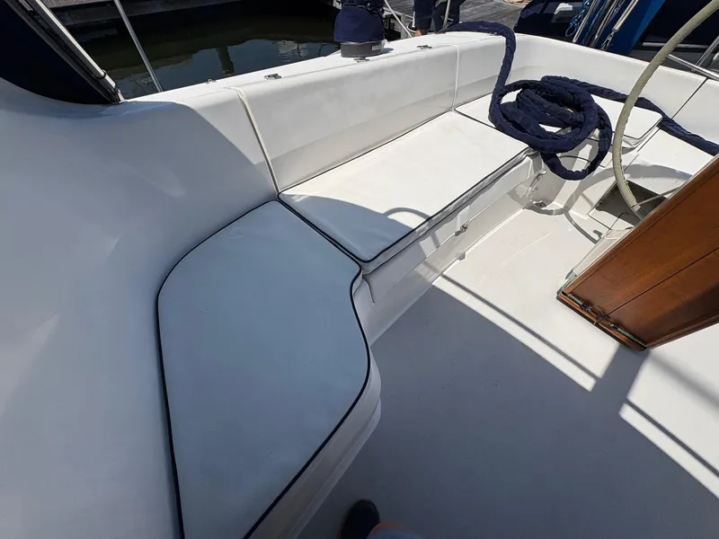 Slide: The Image of Cockpit seating area of a 2006 Catalina 350 sailboat with coiled rope. - 8