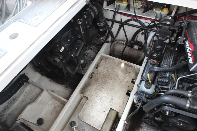 Slide: The Image of Engine compartment of a 1999 Bayliner 3055 Ciera boat, featuring MerCruiser components. - 8
