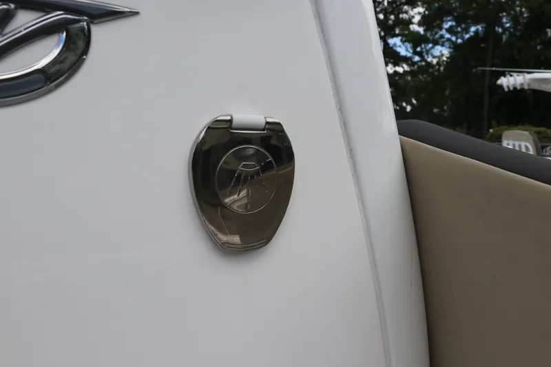 Slide: The Image of 2022 Tidewater 232 SS boat detail with chrome accent and beige upholstery. - 30