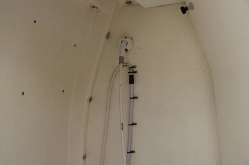 Slide: The Image of Interior view of a 2022 Tidewater 232 SS boat, showing plumbing fixtures. - 33