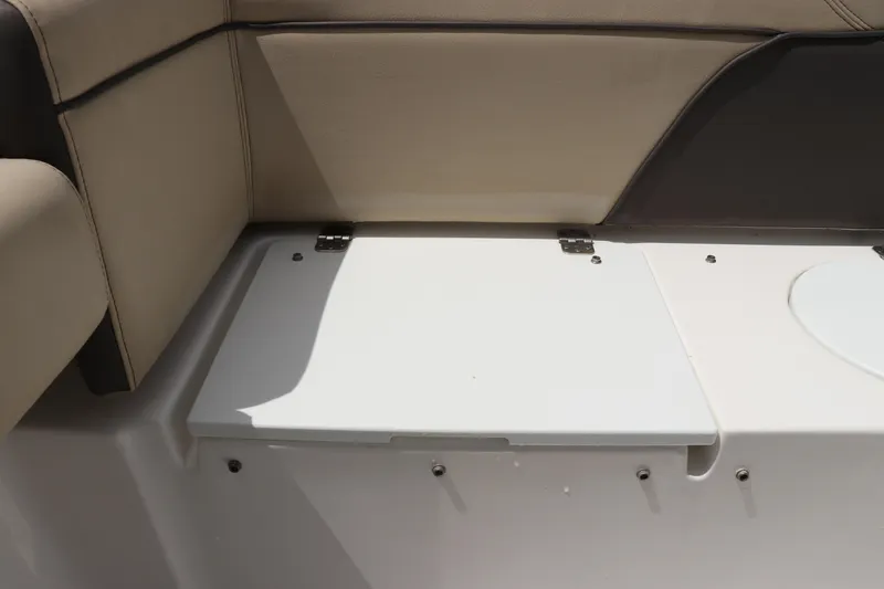 Slide: The Image of 2022 Tidewater 232 SS boat interior seating with storage compartment. - 7