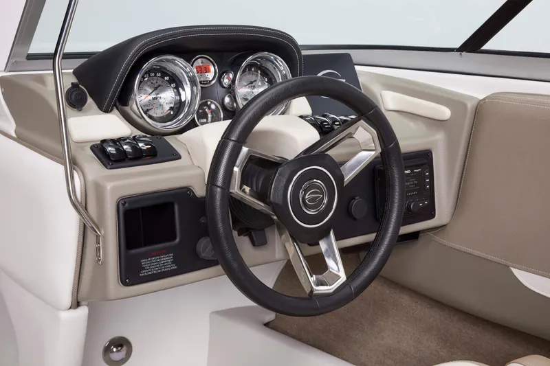 Slide: The Image of 2025 Crownline 220 SS boat dashboard with steering wheel and gauges. - 5