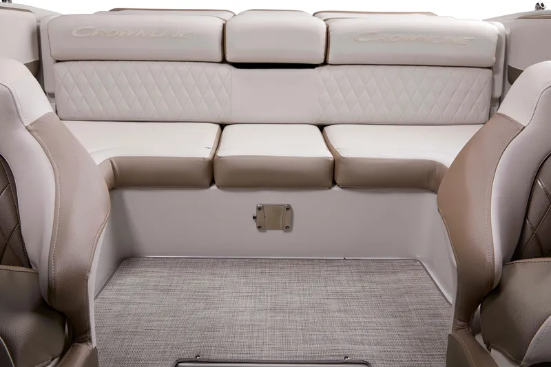 Slide: The Image of 2025 Crownline 220 SS boat interior with beige seating and diamond stitching. - 6