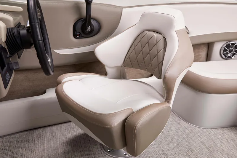 Slide: The Image of 2025 Crownline 220 SS boat interior with luxurious beige and white seating. - 7