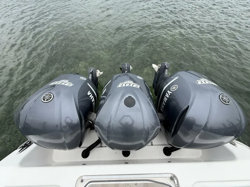 Slide: The Image of Triple Yamaha outboard engines on 2012 Invincible 36 Open Fisherman boat. - 12