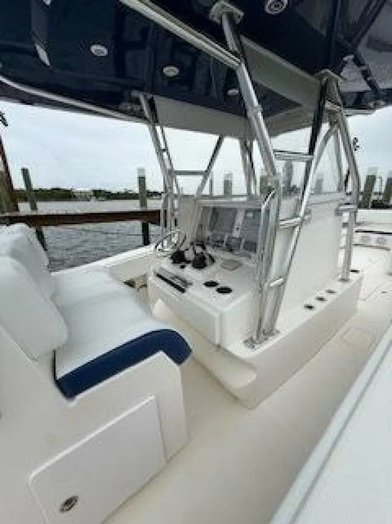 Slide: The Image of 2012 Invincible 36 Open Fisherman boat interior with helm and seating. - 6