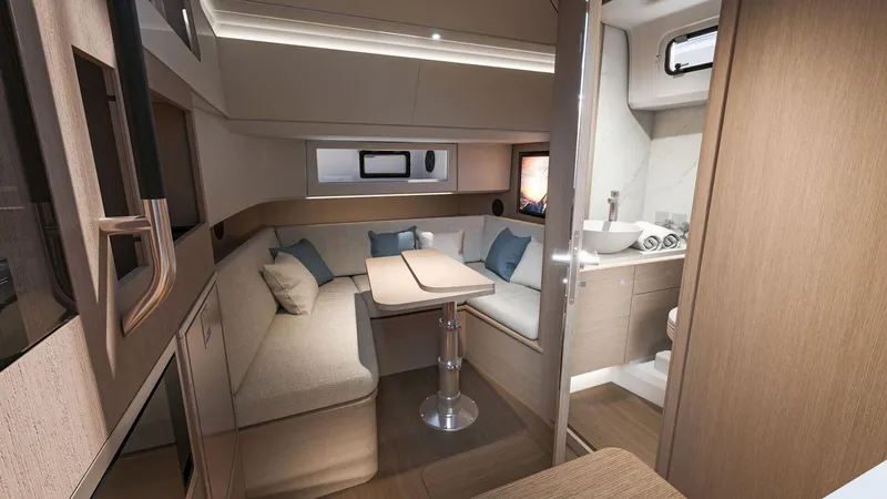 Slide: The Image of Interior of 2026 Beneteau Gran Turismo 35 yacht, featuring modern seating and compact bathroom. - 10