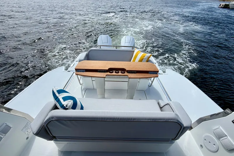 Slide: The Image of 2026 Beneteau Gran Turismo 35 yacht with stylish seating and ocean view. - 16