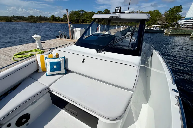 Slide: The Image of 2026 Beneteau Gran Turismo 35 yacht docked, featuring sleek design and comfortable seating. - 19