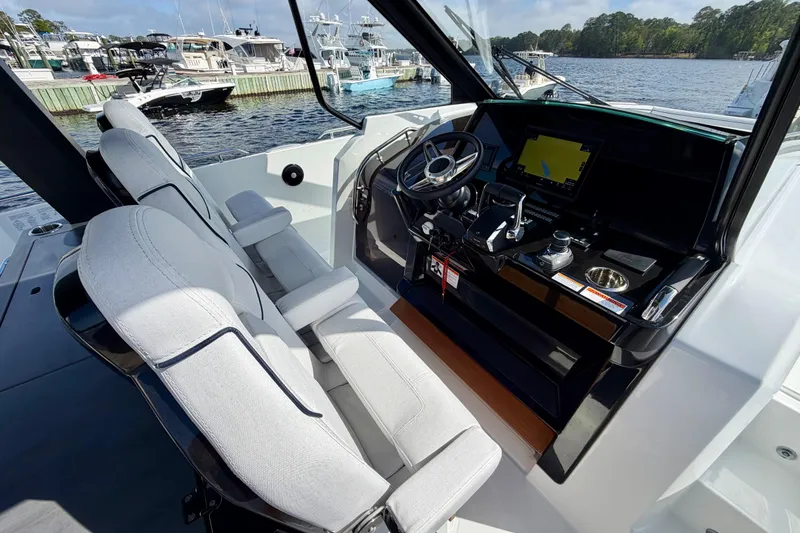 Slide: The Image of Interior cockpit of 2026 Beneteau Gran Turismo 35, featuring modern controls and seating. - 22