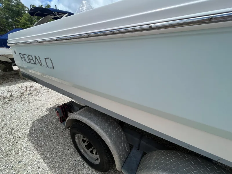 Slide: The Image of 2016 Robalo 206 Cayman boat on trailer, side view with logo visible. - 13