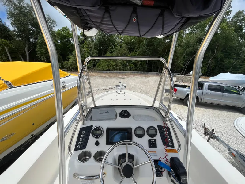 Slide: The Image of 2016 Robalo 206 Cayman boat dashboard with steering wheel and navigation equipment. - 20