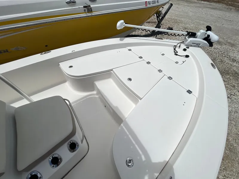 Slide: The Image of 2016 Robalo 206 Cayman boat deck with seating and trolling motor. - 23