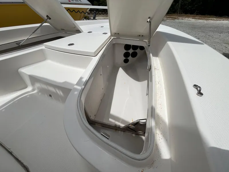 Slide: The Image of Open storage compartment on 2016 Robalo 206 Cayman boat, showcasing interior space. - 25